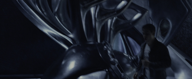 Wide shot frame from Power Rangers — standing, room, hand