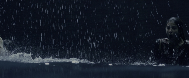 Wide shot frame from Power Rangers — standing, shirt, water