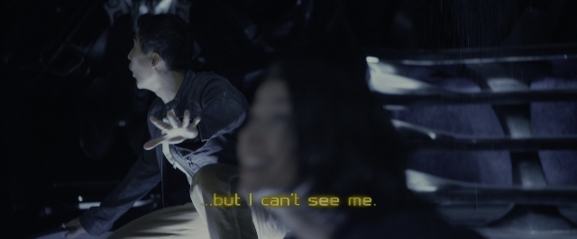 Wide shot frame from Power Rangers — sitting, room, dialogue