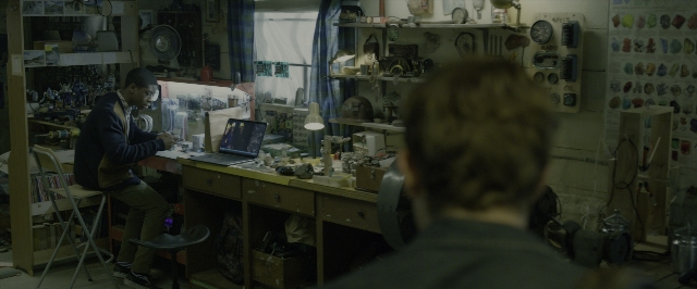 Wide shot frame from Power Rangers — sitting, room, chair