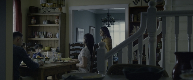 Wide shot frame from Power Rangers — sitting, room, table