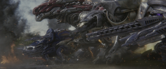 Wide shot frame from Power Rangers — hand, gun, smoke