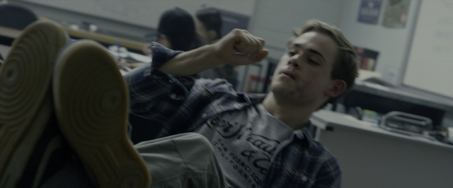 Frame from Power Rangers — sitting, hand, shirt