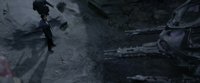 Wide shot frame from Power Rangers — standing, car, hand