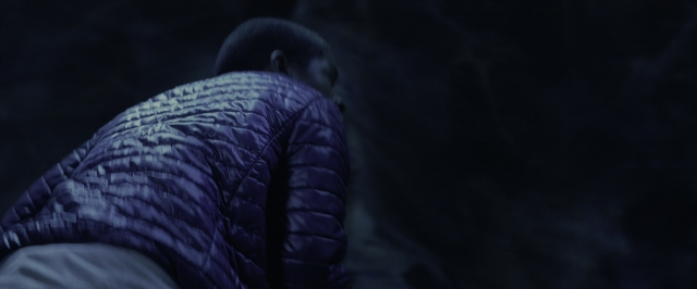 Wide shot frame from Power Rangers — sitting, face, person