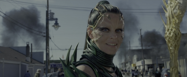 Medium shot frame from Power Rangers — street, hand, face