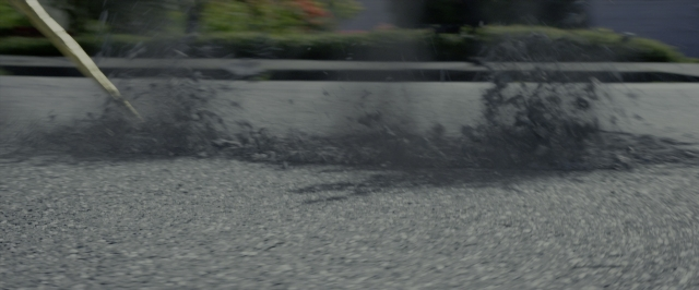 Wide shot frame from Power Rangers — street, water, fountain