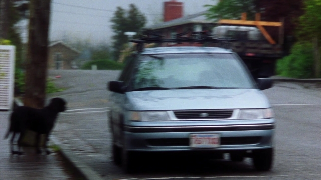 Frame from Practical Magic — walking, plate, street