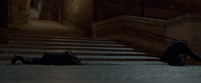 Wide shot frame from John Wick: Chapter Two — people, sitting, action