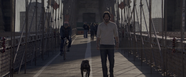 Wide shot frame from John Wick: Chapter Two — walking, dog, shirt
