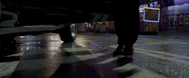 Frame from John Wick: Chapter Two — walking, street, car