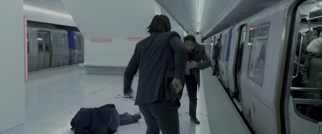 Wide shot frame from John Wick: Chapter Two — walking, train, person