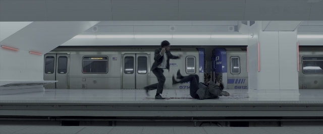 Wide shot frame from John Wick: Chapter Two — standing, phone, hand