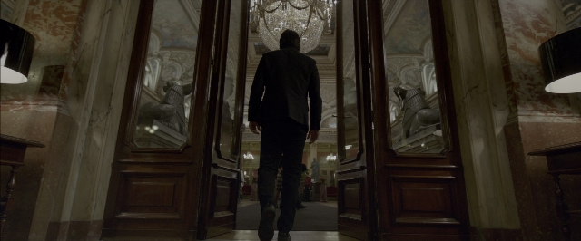 Wide shot frame from John Wick: Chapter Two — walking, room, door