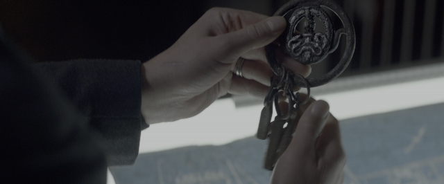 Wide shot frame from John Wick: Chapter Two — hand, person, window