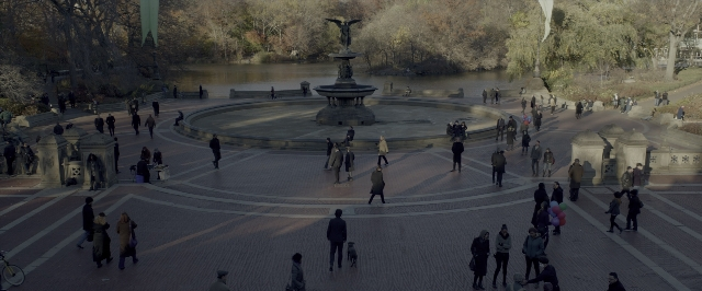 Wide shot frame from John Wick: Chapter Two — walking, street, water