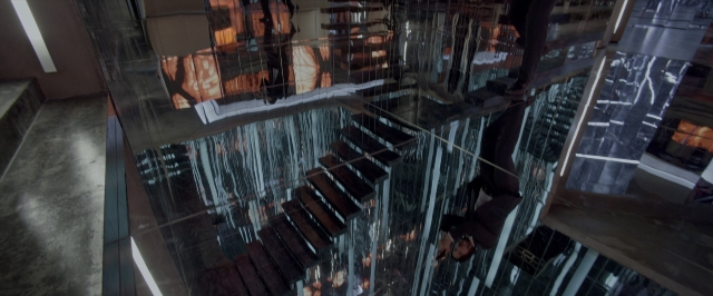 Wide shot frame from John Wick: Chapter Two — walking, mirror, glass