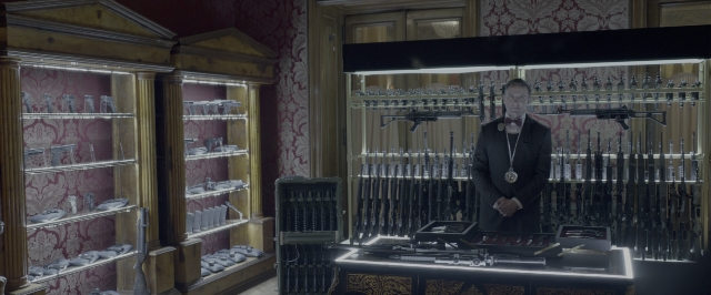 Wide shot frame from John Wick: Chapter Two — standing, room, hand