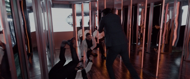 Wide shot frame from John Wick: Chapter Two — standing, room, mirror