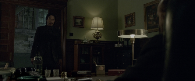 Wide shot frame from John Wick: Chapter Two — standing, room, door