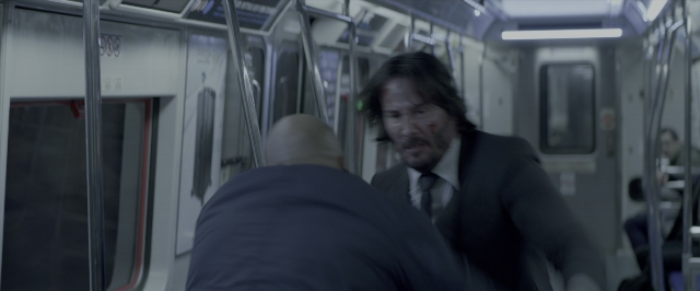 Wide shot frame from John Wick: Chapter Two — walking, suit, tie