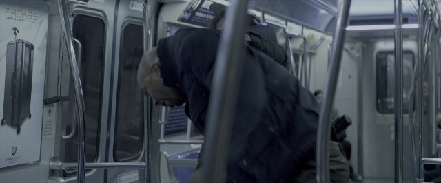 Wide shot frame from John Wick: Chapter Two — car, face, train