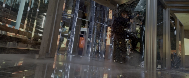 Wide shot frame from John Wick: Chapter Two — room, glass, building
