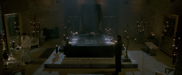 Wide shot frame from John Wick: Chapter Two — standing, room, bed