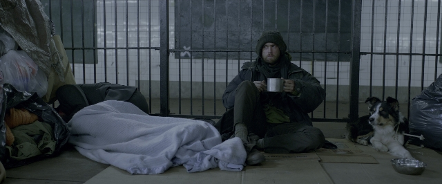 Wide shot frame from John Wick: Chapter Two — sitting, dog, coat