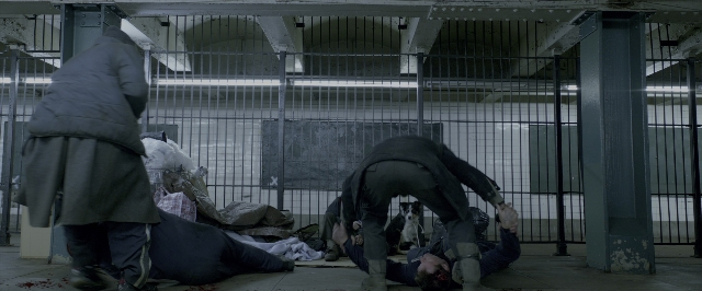 Wide shot frame from John Wick: Chapter Two — standing, walking, coat
