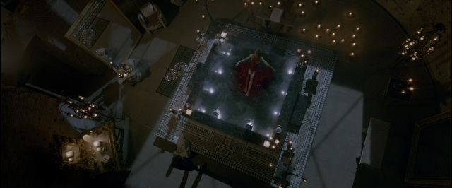 Wide shot frame from John Wick: Chapter Two — standing, room, table