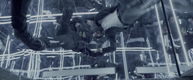 Wide shot frame from John Wick: Chapter Two — room, glass, person