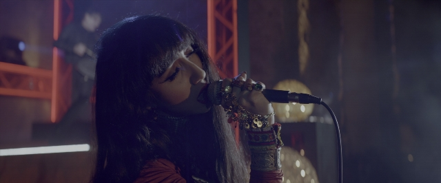 Frame from John Wick: Chapter Two — room, microphone, hair