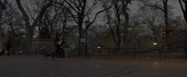 Wide shot frame from John Wick: Chapter Two — book, walking, street