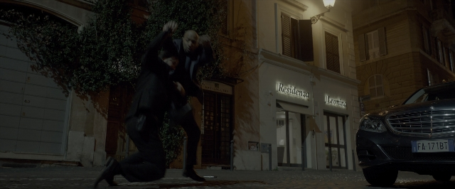 Wide shot frame from John Wick: Chapter Two — standing, street, car