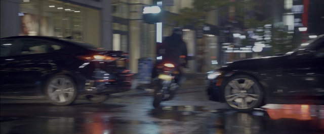Wide shot frame from John Wick: Chapter Two — street, car, night