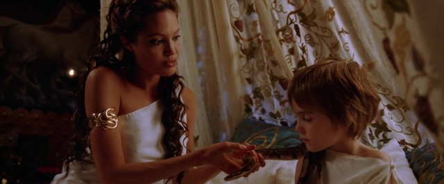 Wide shot frame from Alexander — sitting, bed, hand