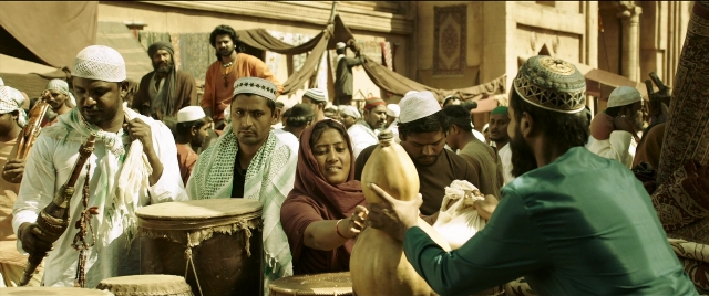 Wide shot frame from Bãhubali 2: The Conclusion — shirt, drum, person