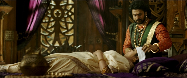 Wide shot frame from Bãhubali 2: The Conclusion — book, room, bed