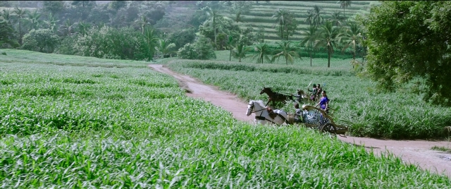 Wide shot frame from Bãhubali 2: The Conclusion — street, horse, train