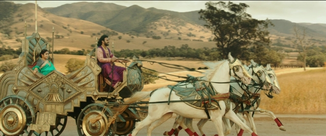 Wide shot frame from Bãhubali 2: The Conclusion — sitting, horse, cart