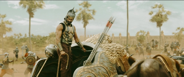 Wide shot frame from Bãhubali 2: The Conclusion — standing, horse, train