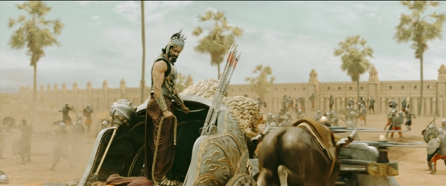 Wide shot frame from Bãhubali 2: The Conclusion — standing, horse, train
