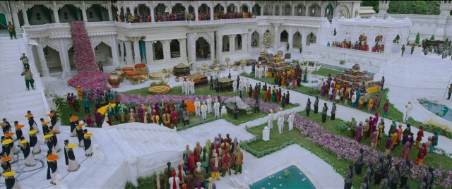 Wide shot frame from Bãhubali 2: The Conclusion — bed, person, building