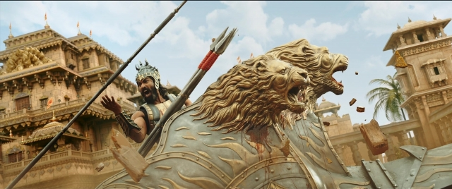 Frame from Bãhubali 2: The Conclusion — standing, hat, beard