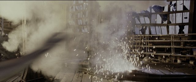 Wide shot frame from Spider-Man 2 — room, smoke, window