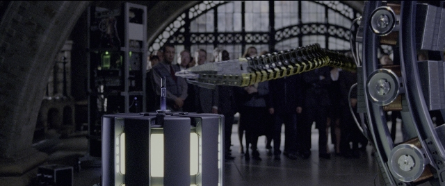 Wide shot frame from Spider-Man 2 — standing, room, dialogue