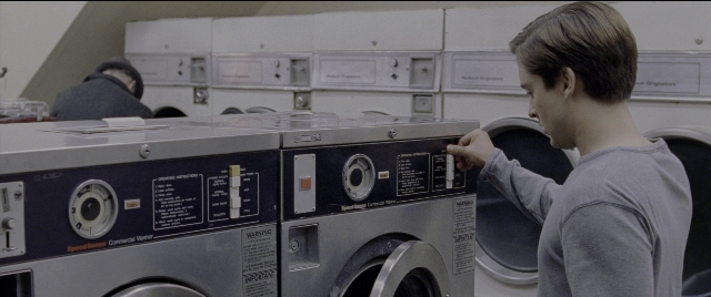 Wide shot frame from Spider-Man 2 — standing, room, person