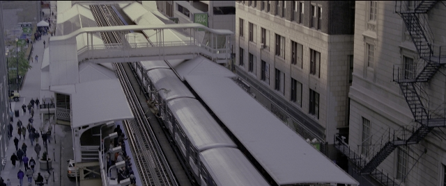 Wide shot frame from Spider-Man 2 — walking, street, fire