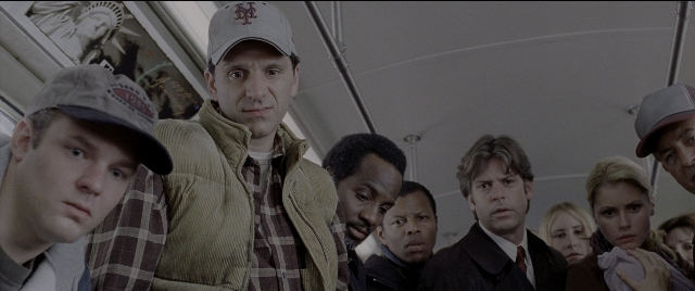 Wide shot frame from Spider-Man 2 — standing, hat, shirt